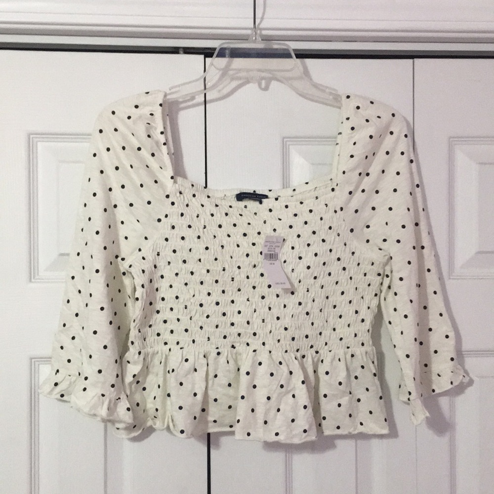 Polka dot peplum ruffle sleeve top